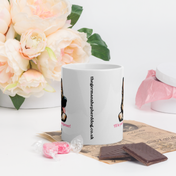 White mug with Gsd head on with Valentines day message "I'll be your Valentine furever! " placed on surface with chocolate and flowers valentines day